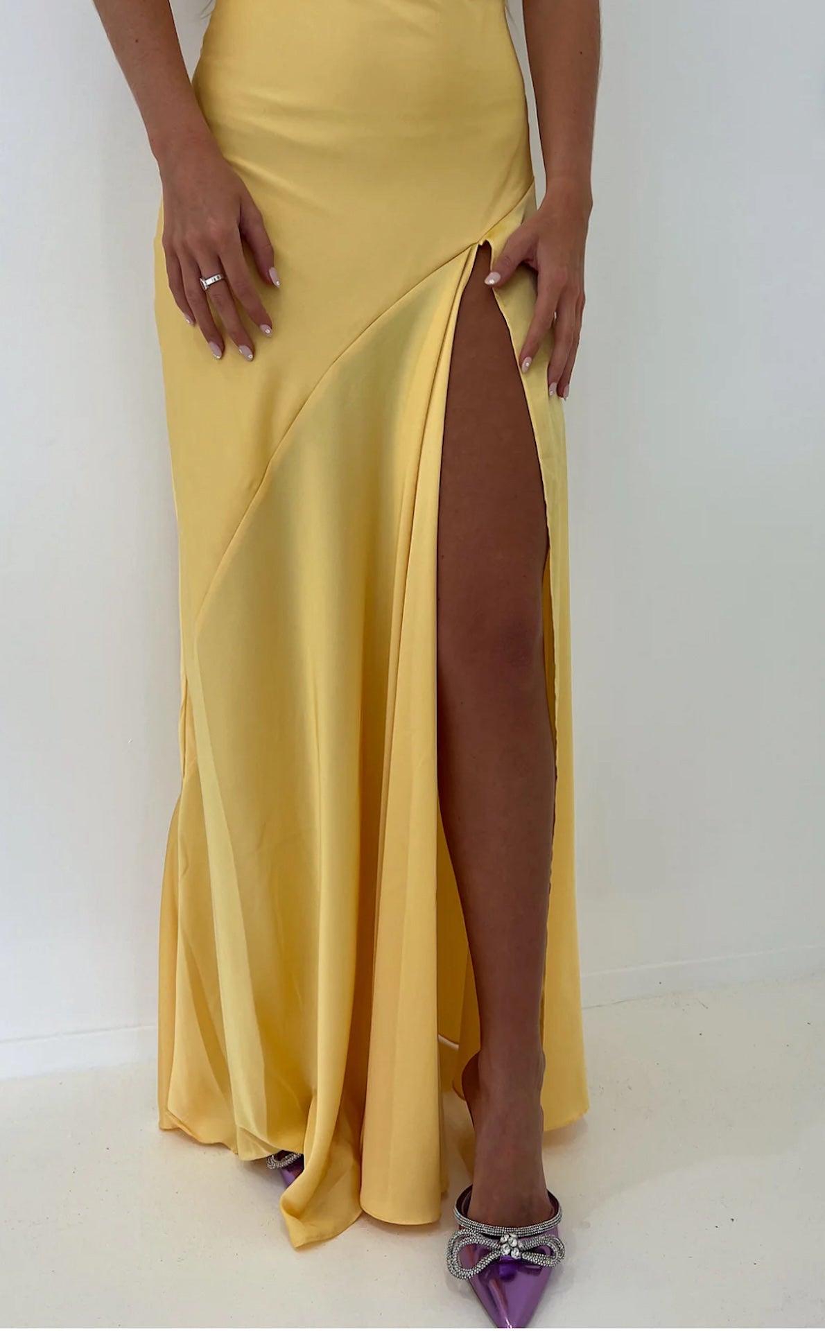 Hntr the Label Gaia Gown in yellow Sun, showing leg split detail. 