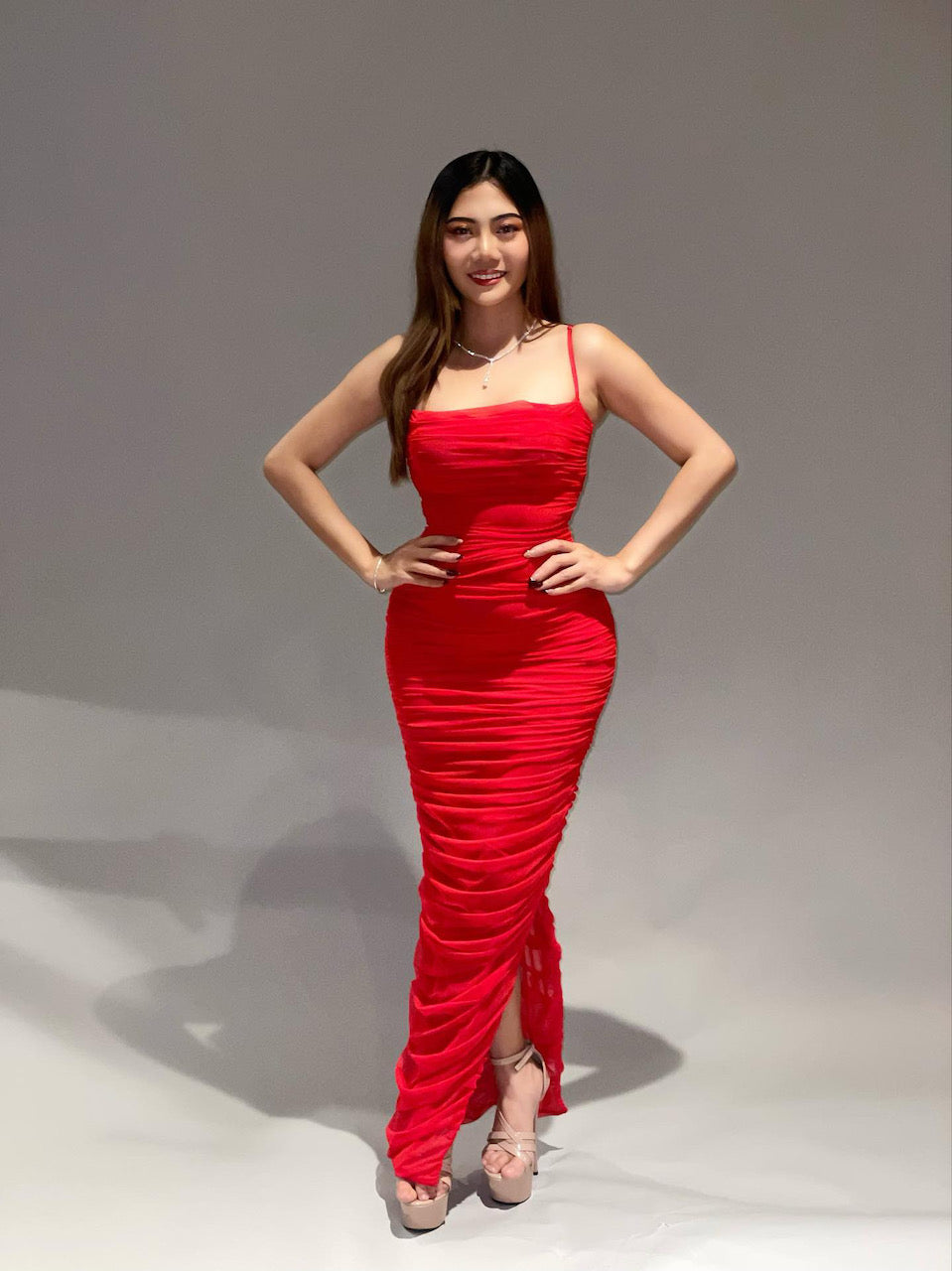 House of CB dress rental Auckland. Red dress with ruched detail and side split. 