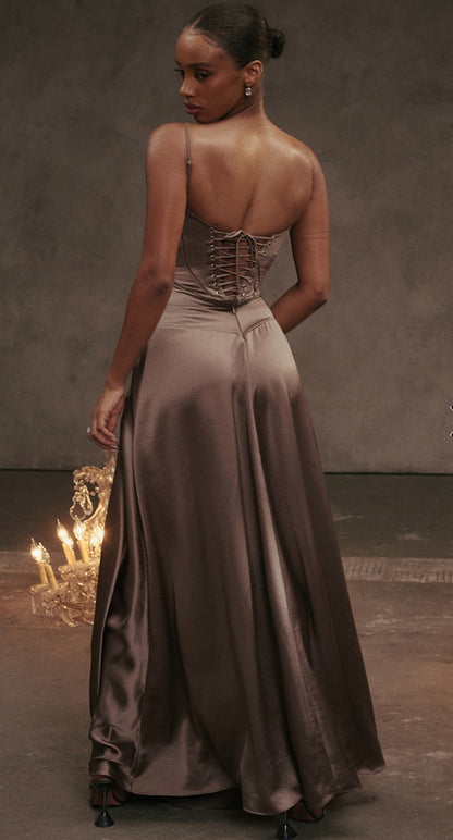 House of CB Anabella Dress in Smoke Brown, showing back of the dress and chandelier on the floor.
