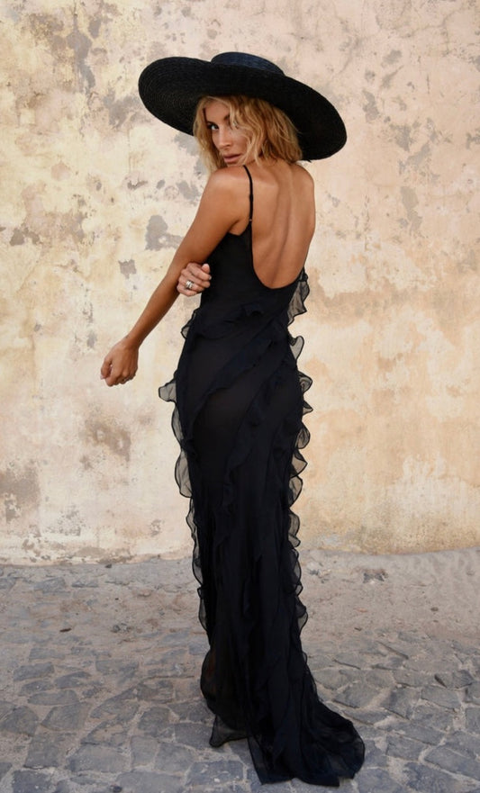 Rat and Boa Selena Dress in black silk chiffon angled back and side view with textured wall behind. 