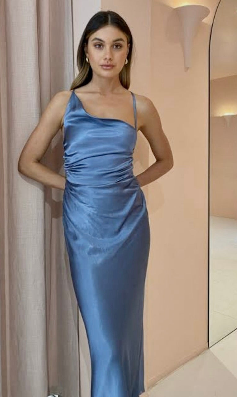 Shona Joy Asymmetrical Cowl Midi DRess close up of dress in Blue Smoke on model with dark hair and beige background.