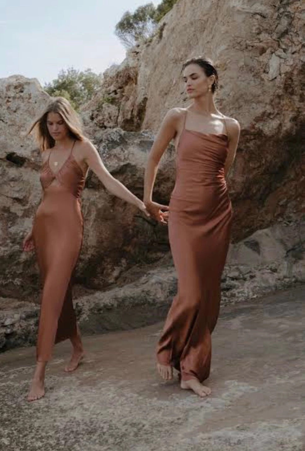 Shona Joy La Lune Lace Back Maxi Dress Copper - two woemn on beach holding hands.